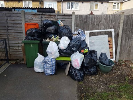 Commercial waste collection truck servicing a business in Forest Gate