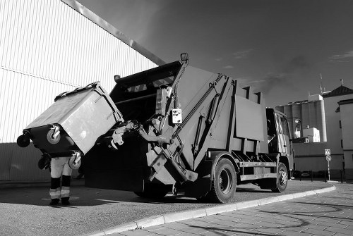 Team members sorting recyclable materials for commercial waste management